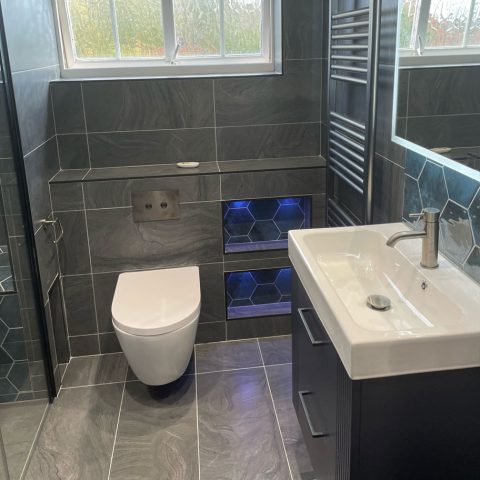 sink toilet radiator mirror tiled walk in shower