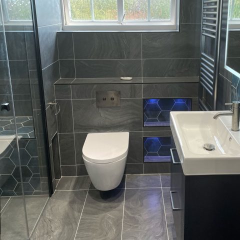 sink toilet radiator mirror tiled walk in shower